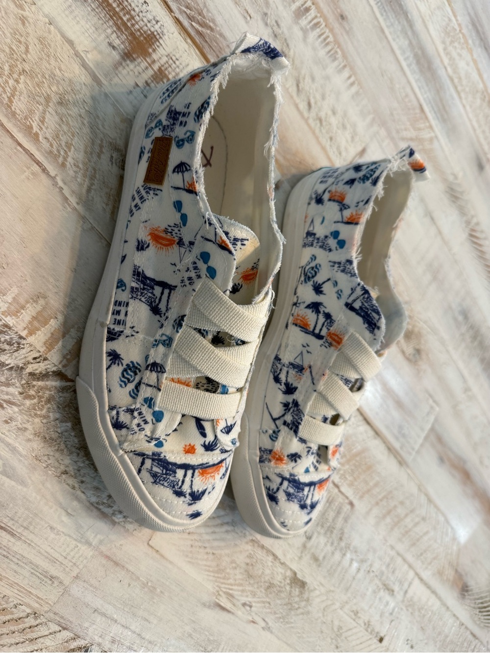 Blowfish women’s Canvas Slip-Ons in White with Navy & Orange Print